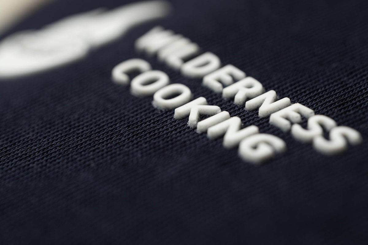 EU Mickey the Goat Inspired Navy Blue T-Shirt with Side Wilderness Cooking Logo - Home&Wild